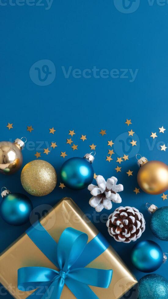 Light Blue and Gold Christmas Arrangement with Gift Box and Baubles on Light Blue Background. Elegant, Festive Christmas Banner, Template, Copy Space, Social Media Post photo