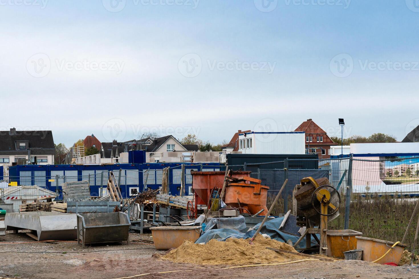 Construction site with various materials and equipment in urban area photo