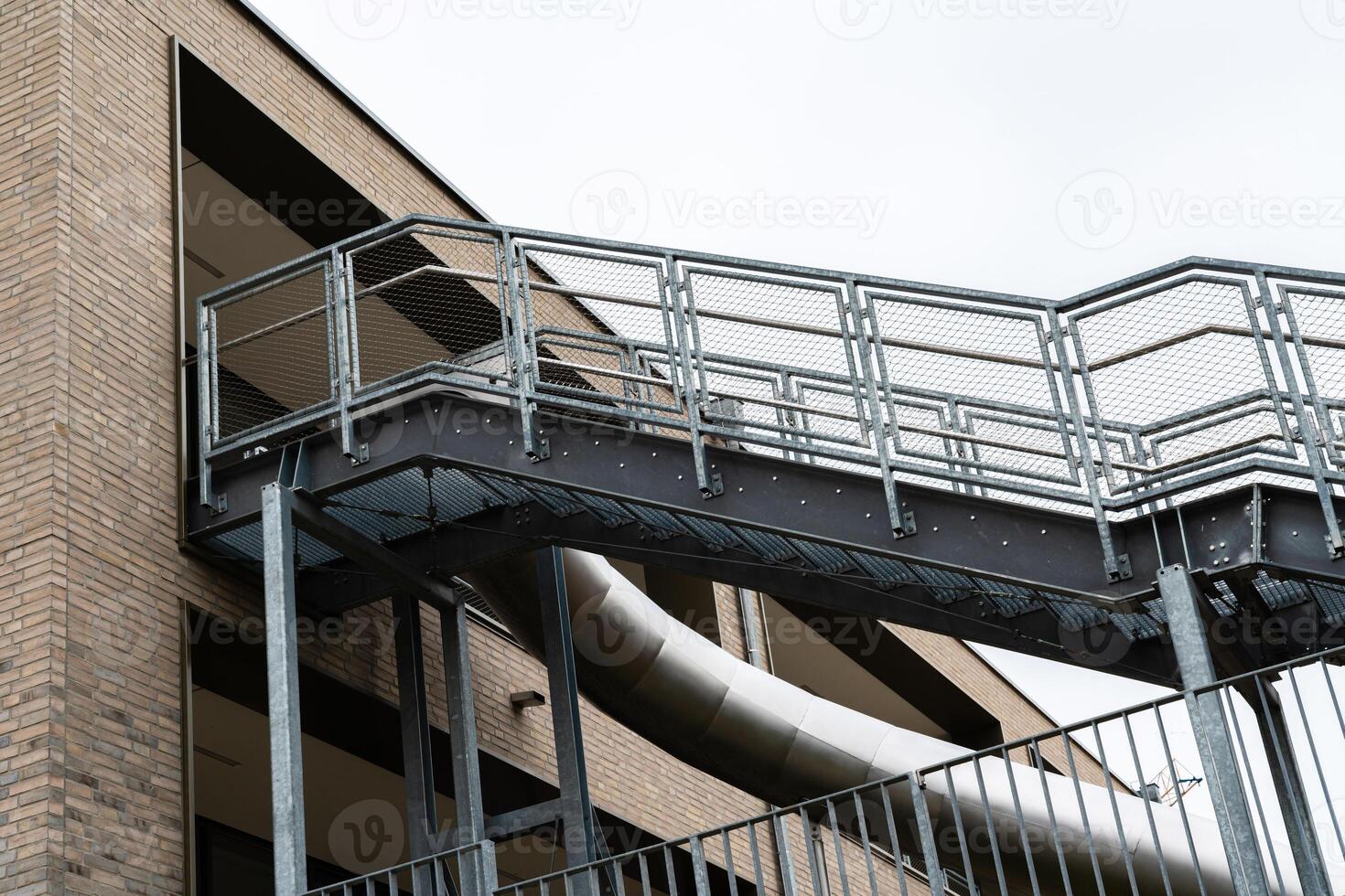 Metal slide and ramp structure at urban building entrance photo