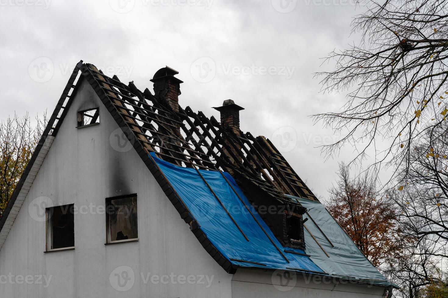 Roof damage observed on a building following severe weather conditions photo