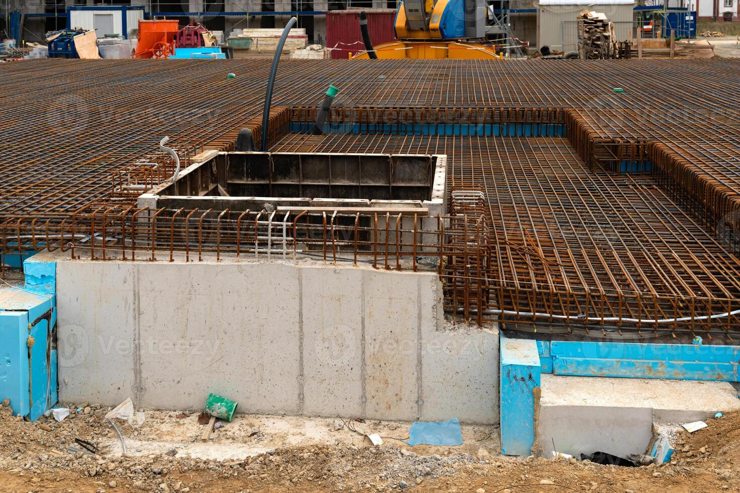 Construction site featuring foundation work and rebar installation photo