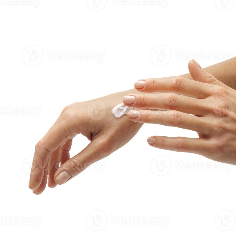 female hands apply cream one on top of the other on a white background photo