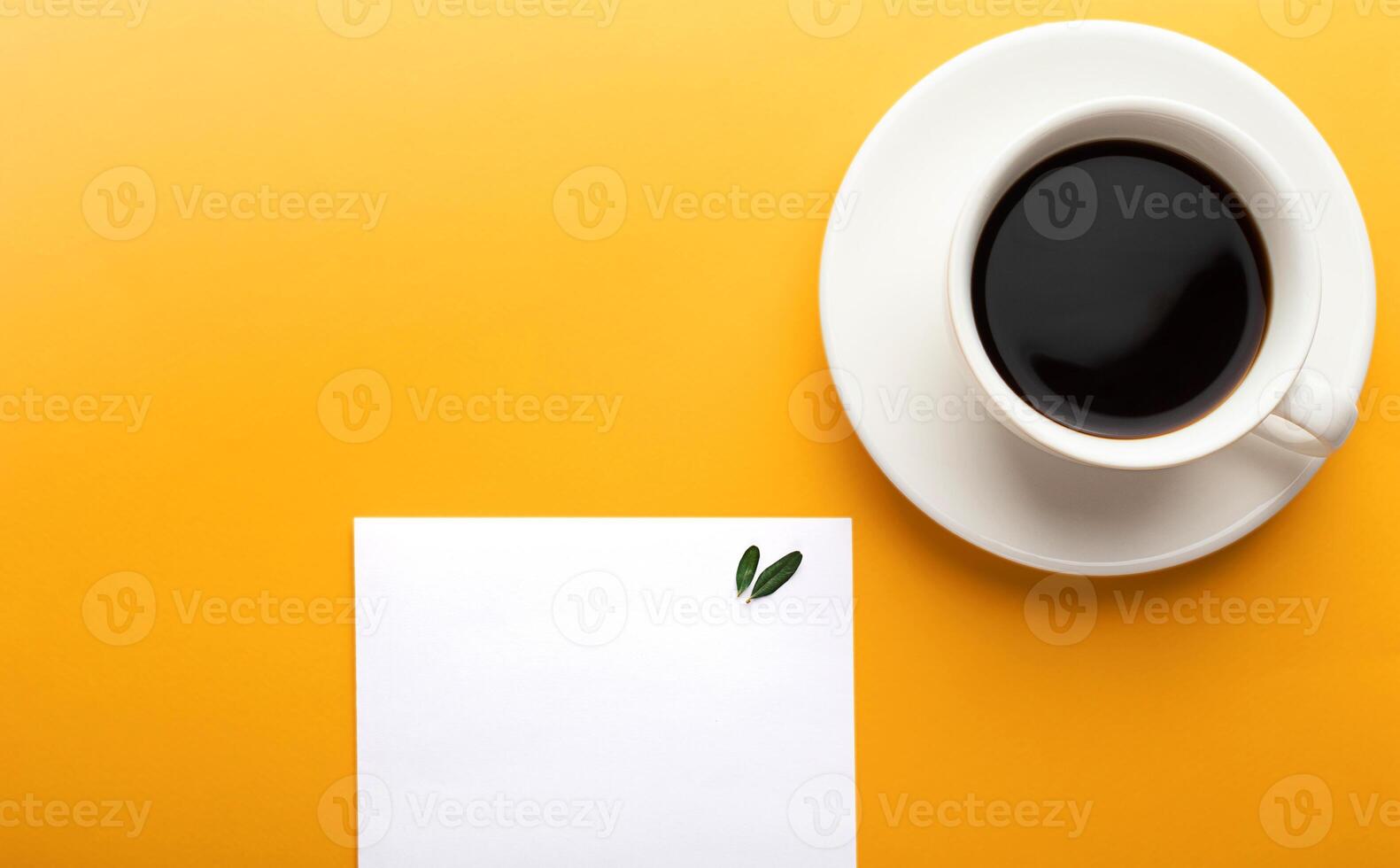 Empty sheet of paper notepad and a cup of coffee on a yellow background with copy space. Mockup photo