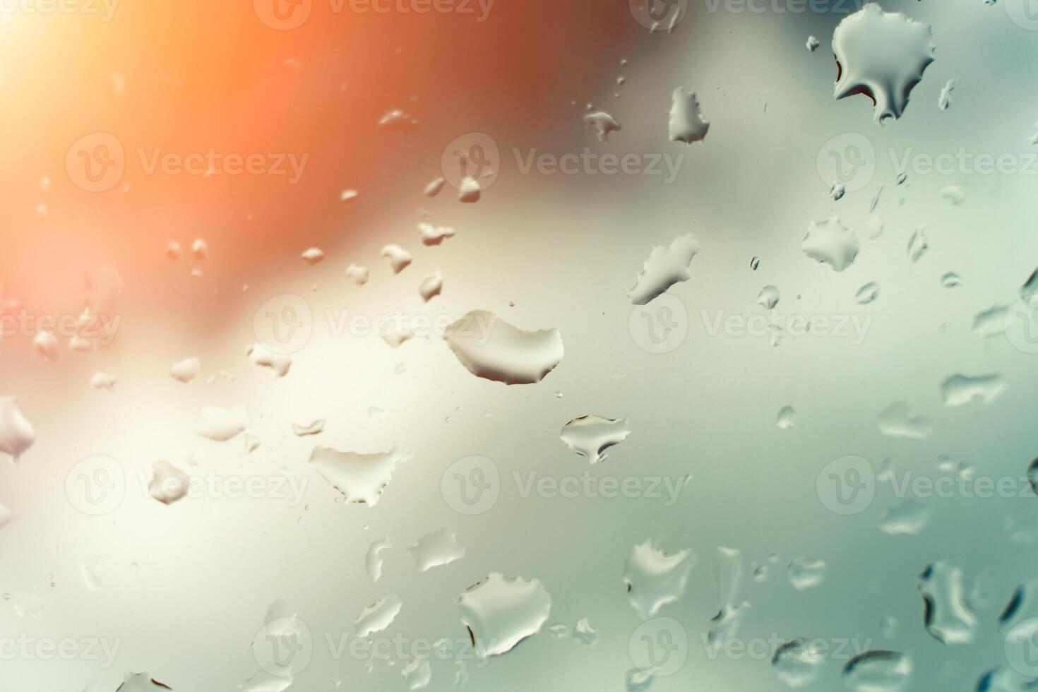 Water drops on glass against blue sky. Window view background screensaver. Place for text banner. photo