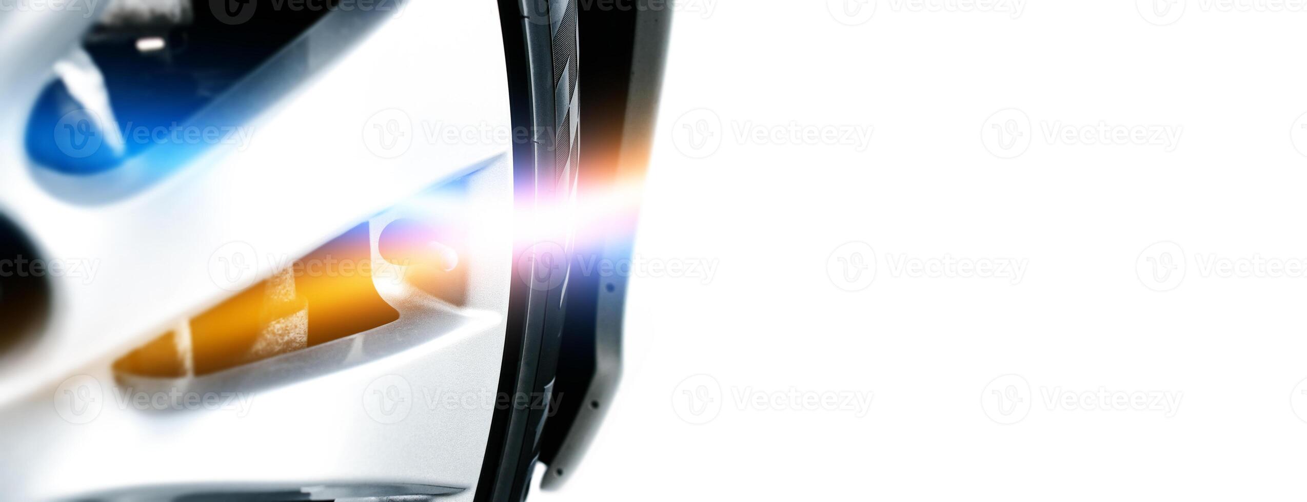 Close up of automotive wheel with lens flare , horizontal banner with copy space for text decoration , Automotive concept photo