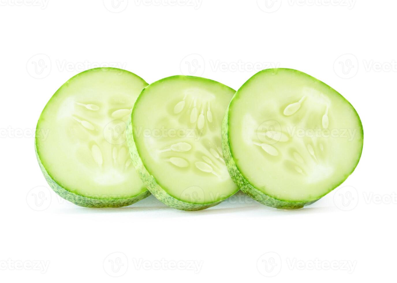 Side view of fresh green cucumber slices in circle shape in stack isolated on white background with clipping path photo