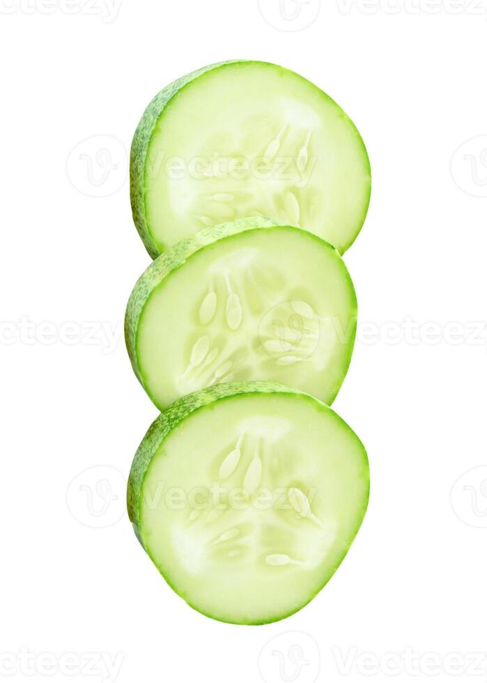 Top view of fresh green cucumber slices in circle shape in stack isolated on white background with clipping path photo