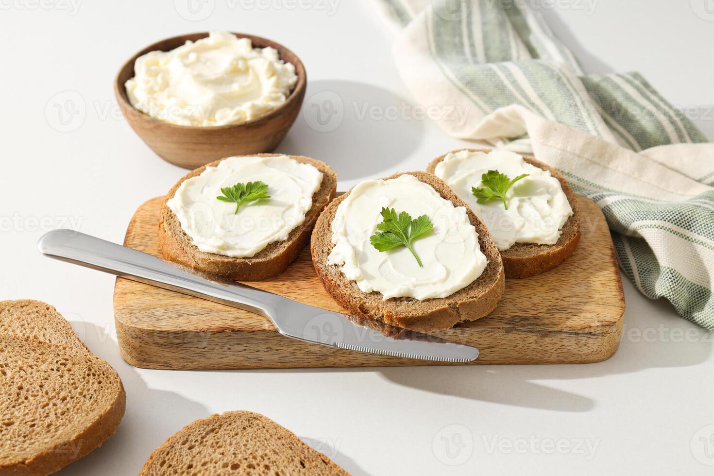 Sandwiches with Philadelphia cheese on a light background. photo