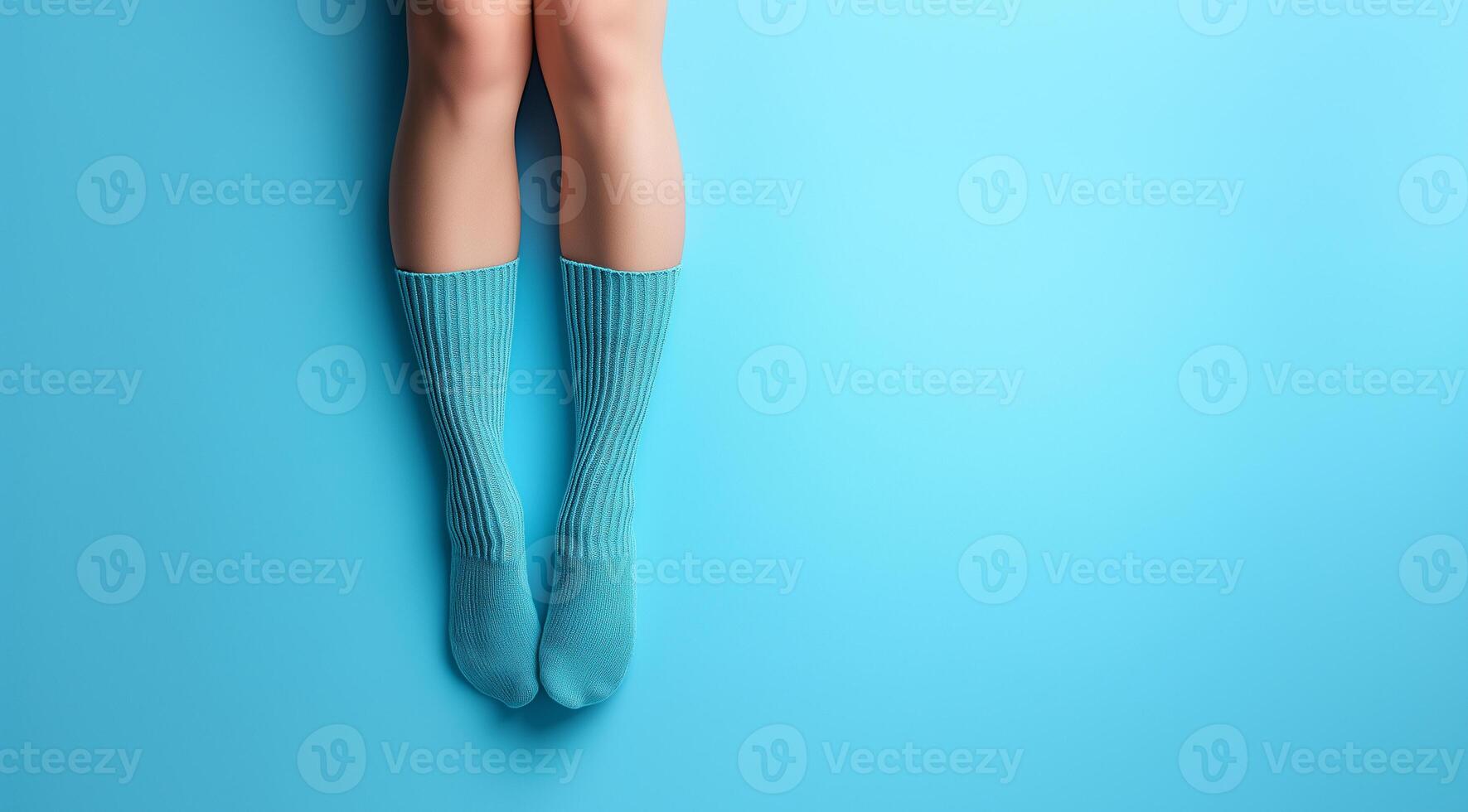 Knitted things, socks on feet, created using technology. photo