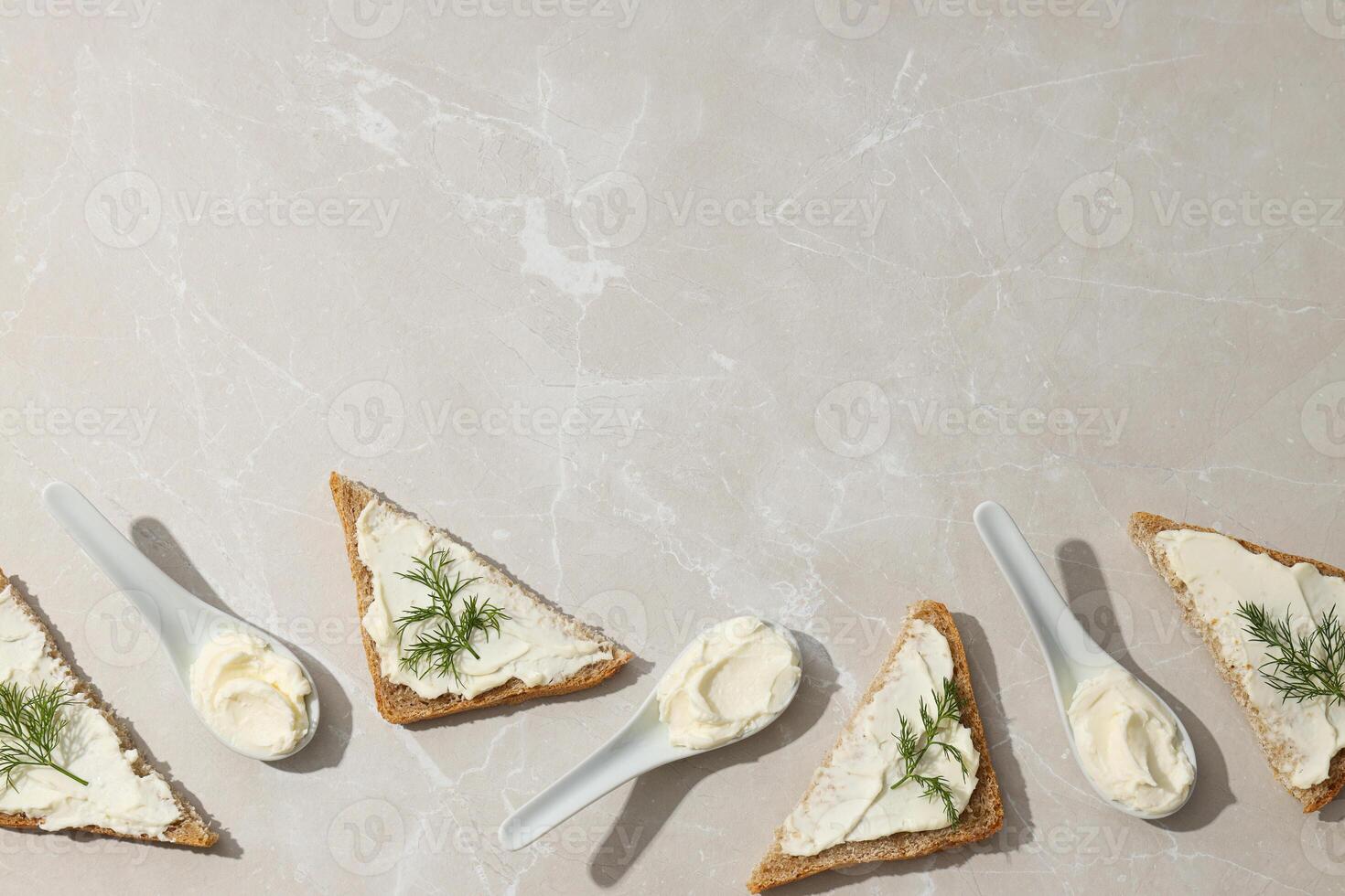 Sandwiches with Philadelphia cheese on a light background. photo