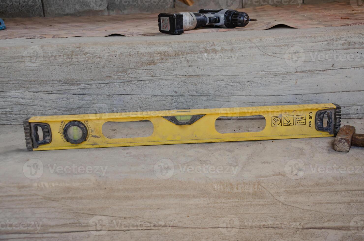 Level Meter Lying On Floor, Construction Tool For Leveling. High quality photo
