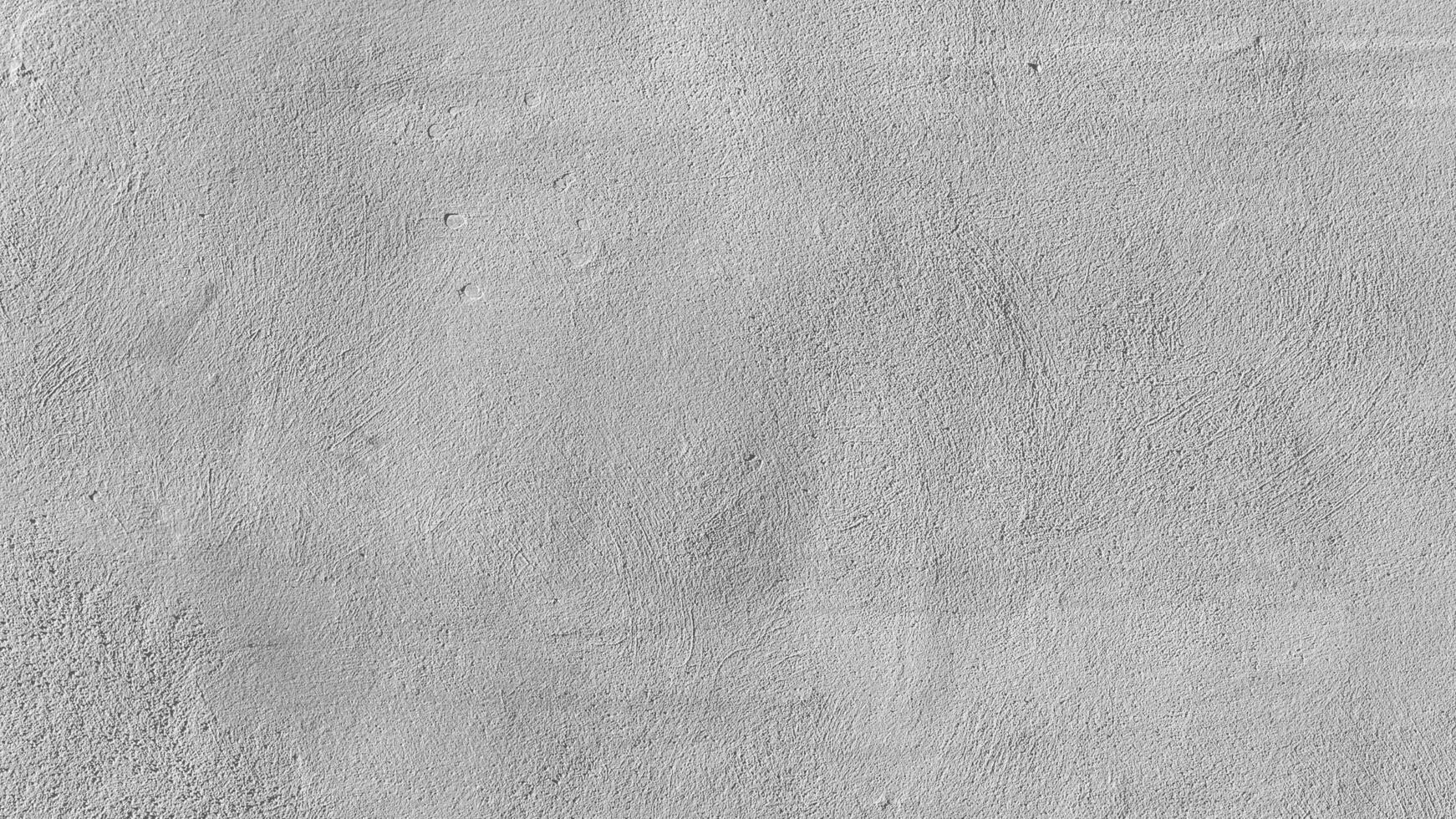 Old cement wall with beautiful pattern in retro concept. Concrete background for wallpaper or graphic design. Blank plaster texture in vintage style. Modern house interiors that feel calm and simple. photo