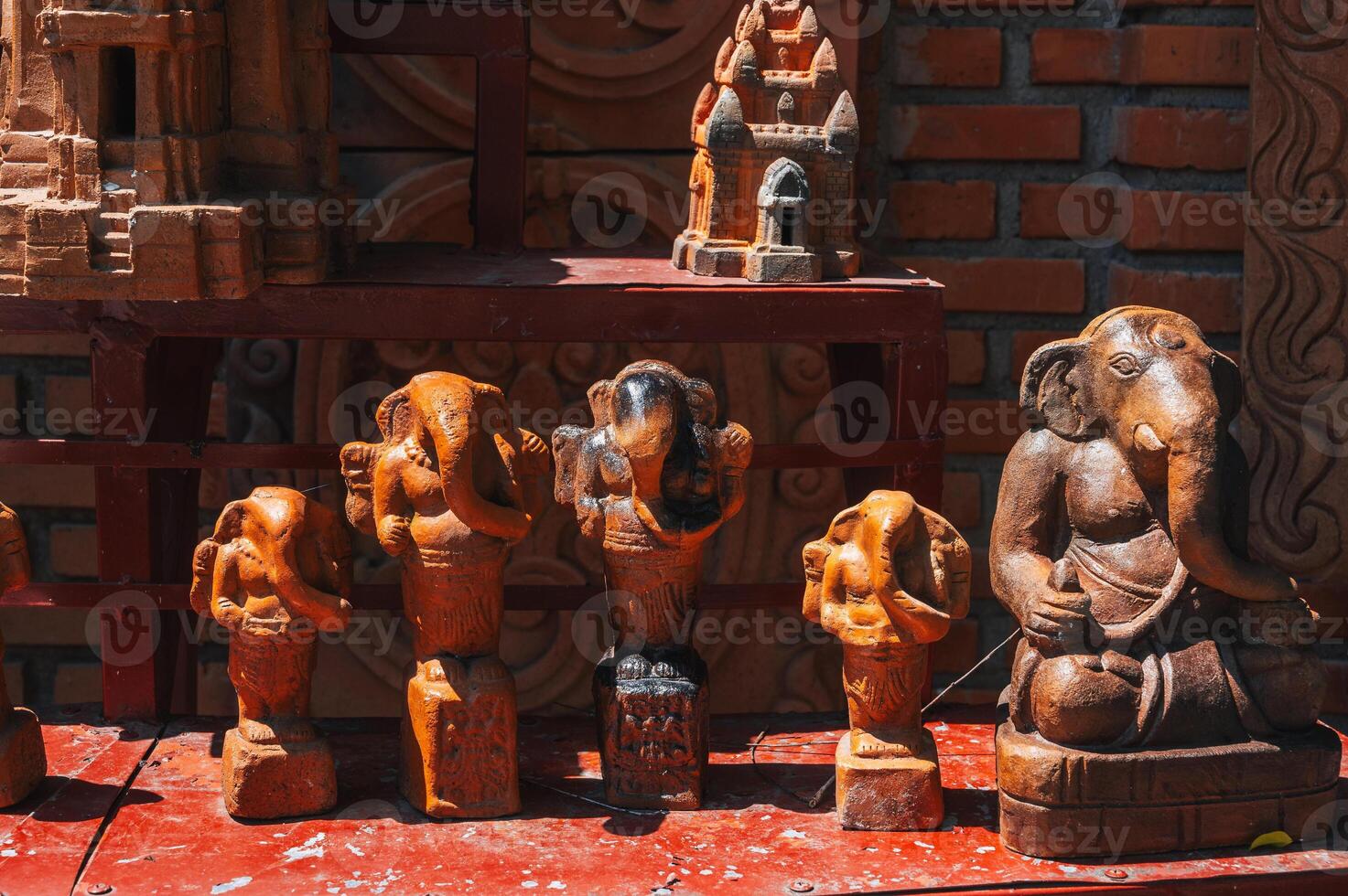 Buddhist clay figurines and ceramics at the souvenir shop on the towers of Po Nagar Cham in Nha Trang, Vietnam photo