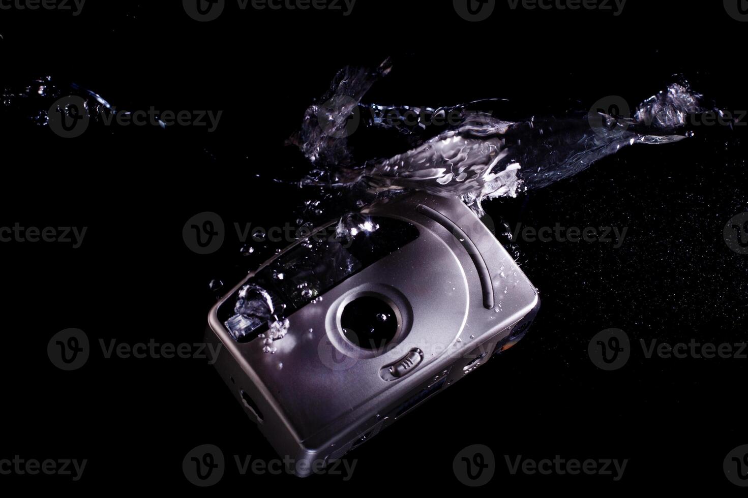 Drowning analog camera symbolizing technological evolution photo