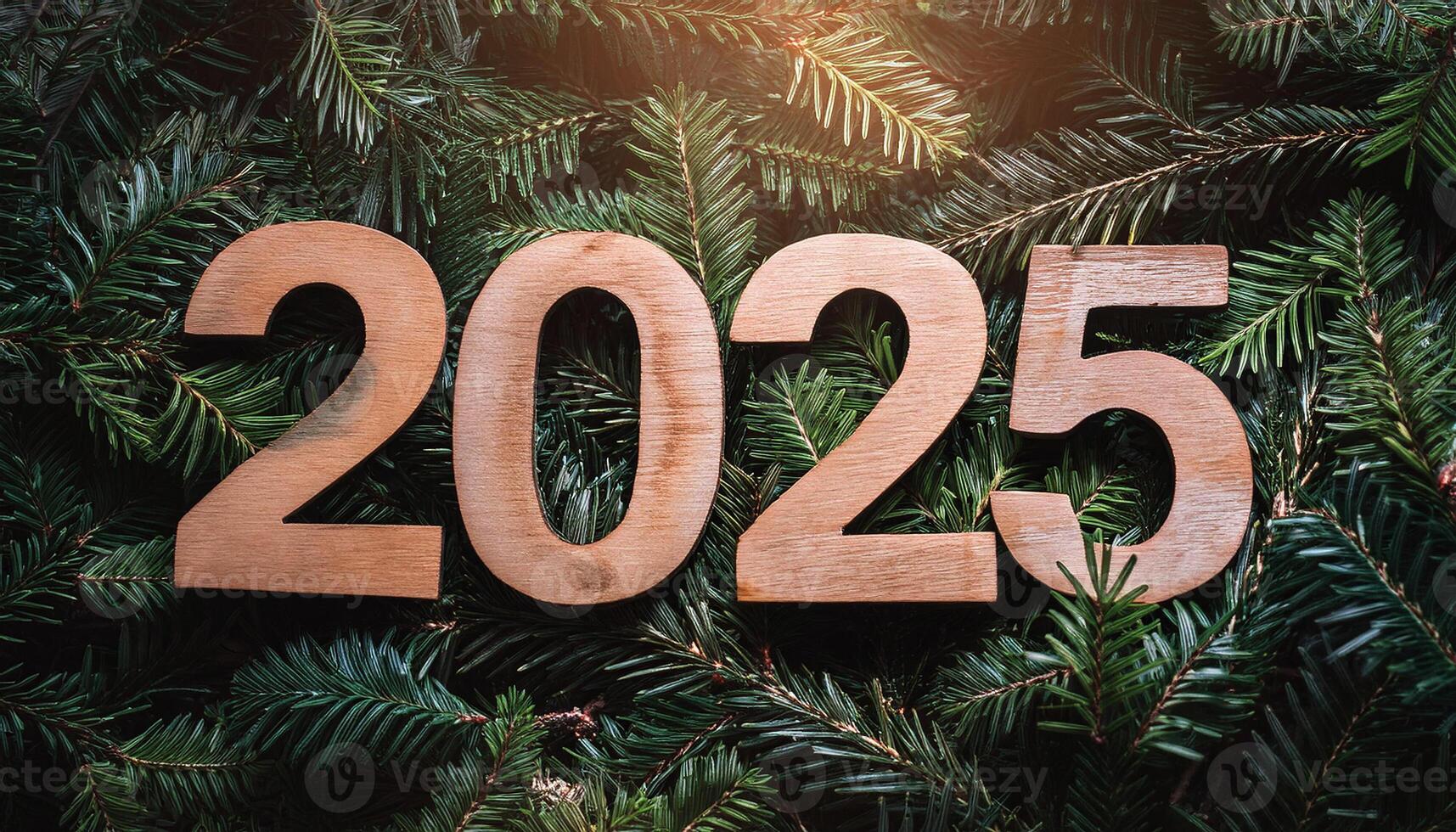 2025 numbers made of wood over fir tree branches, Happy New year concept, photo