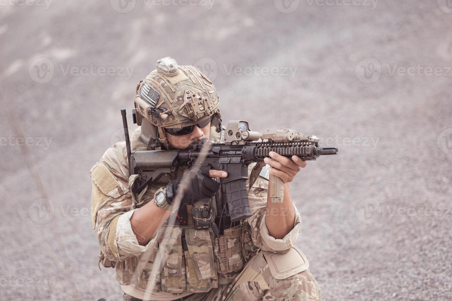 Soldiers in camouflage military uniforms carrying weapons, Reconnaissance missions in rugged mountains, Assault infantry battle training. photo