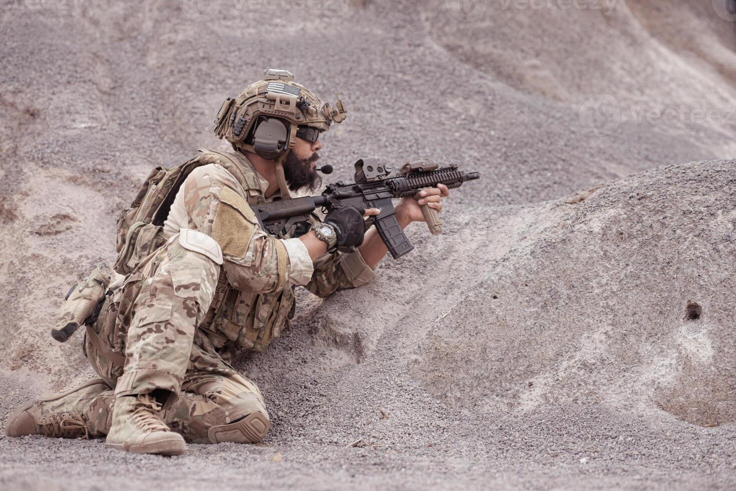 Soldiers in camouflage military uniforms carrying weapons, Reconnaissance missions in rugged mountains, Assault infantry battle training. photo