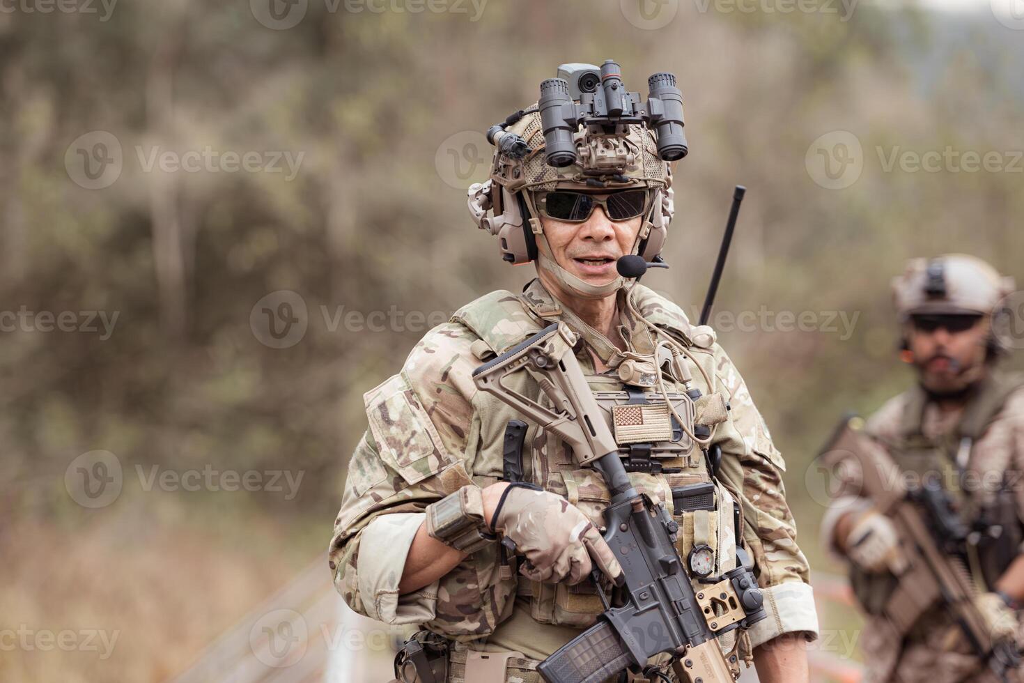Soldiers in camouflage military uniforms carrying weapons, Reconnaissance missions in the tropical forest area, Assault infantry battle training. photo
