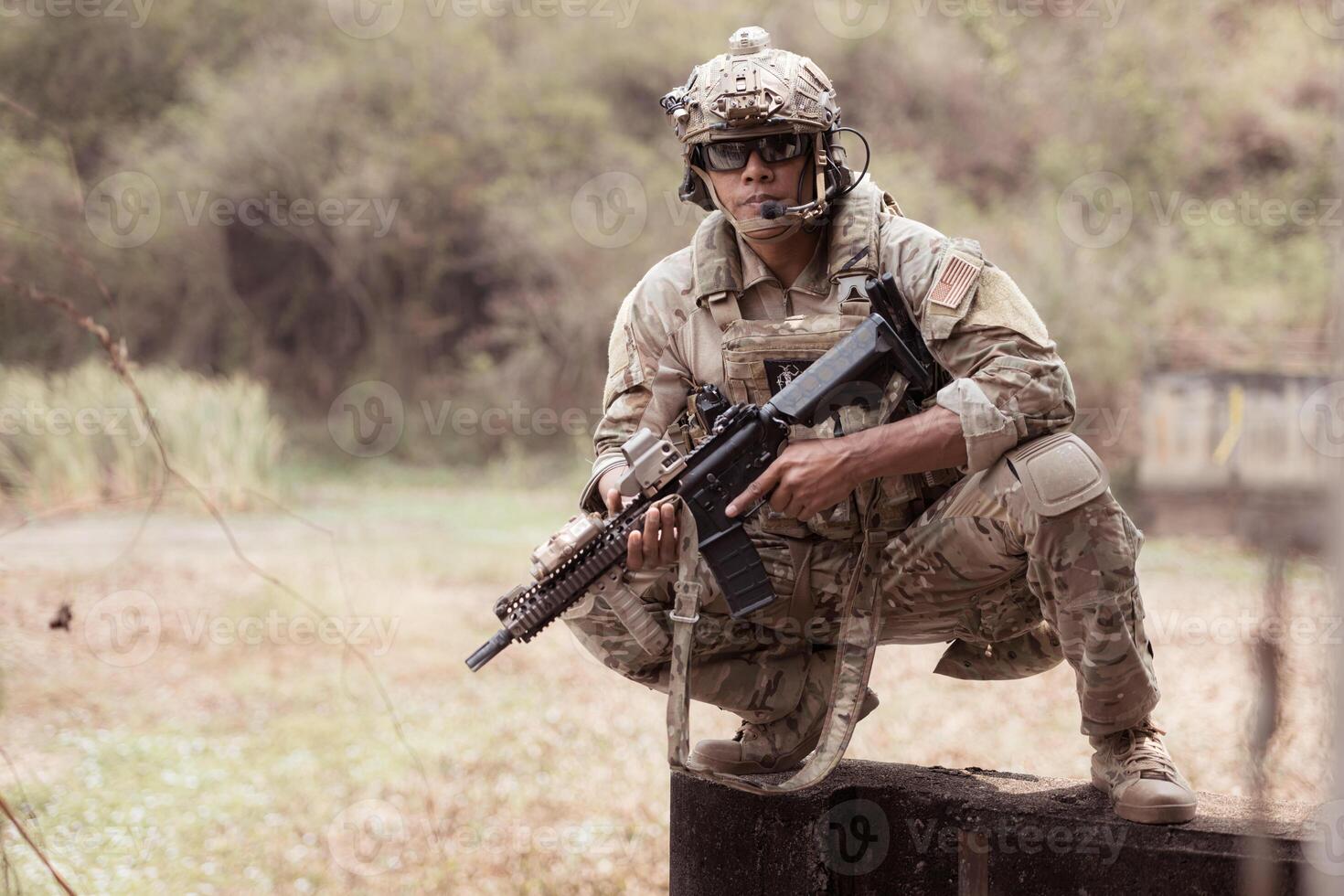 Soldiers in camouflage military uniforms carrying weapons, Reconnaissance missions in the tropical forest area, Assault infantry battle training. photo