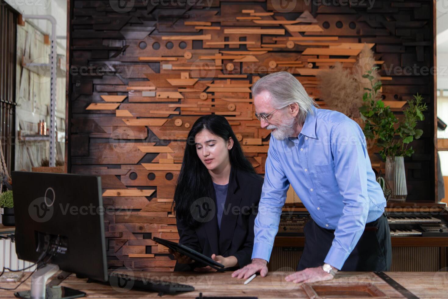 A businessmen and businesswomen working on computer in a modern office room photo