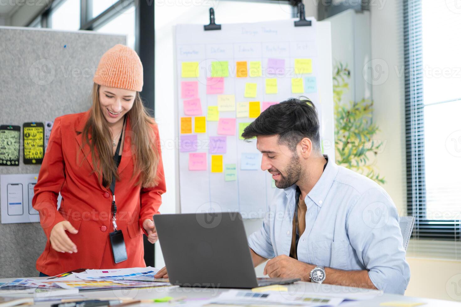 Multiethnic young business people working together in modern office, Collaborate to designing an application for use on the internet network. photo