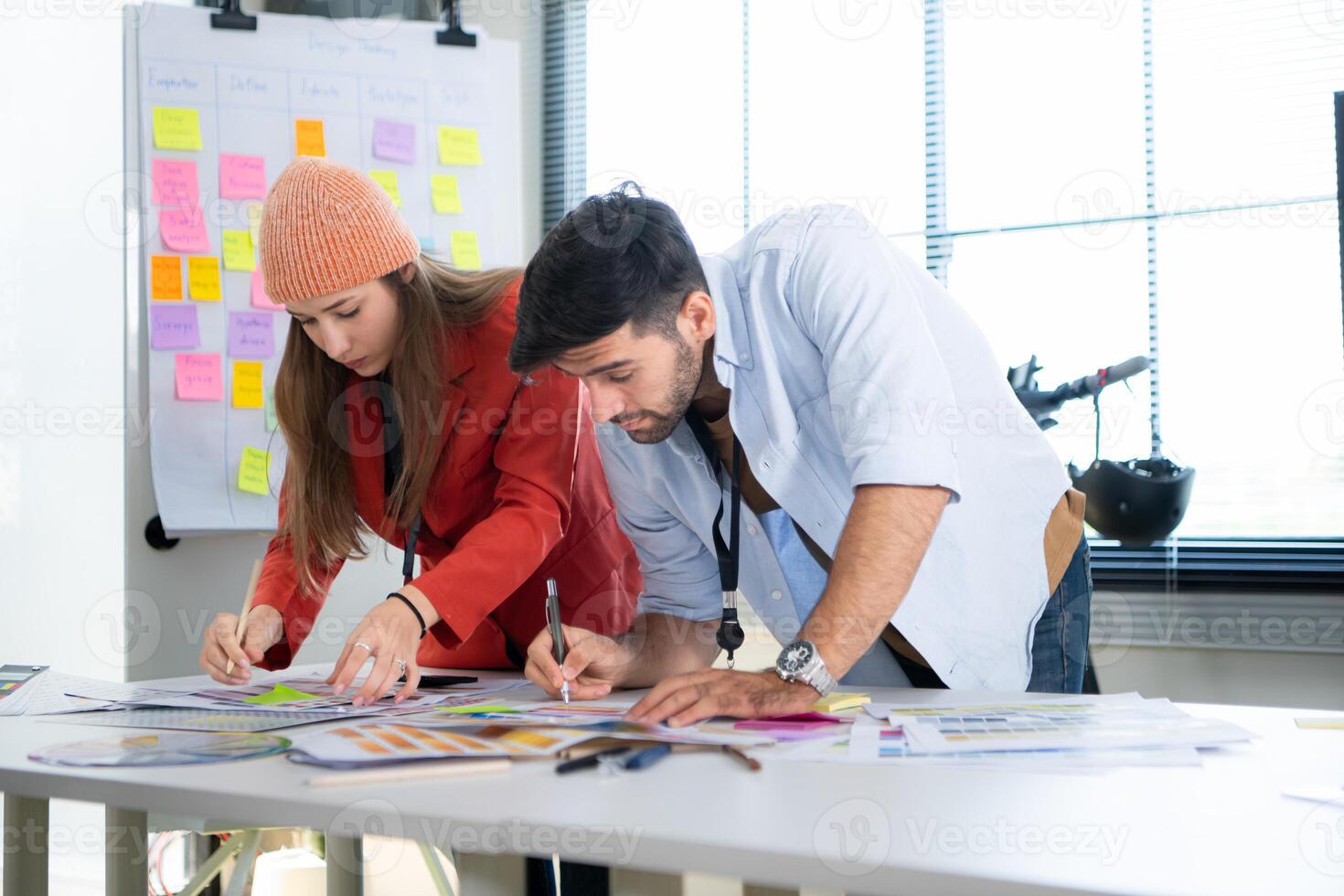 Multiethnic young business people working together in modern office, Collaborate to designing an application for use on the internet network. photo