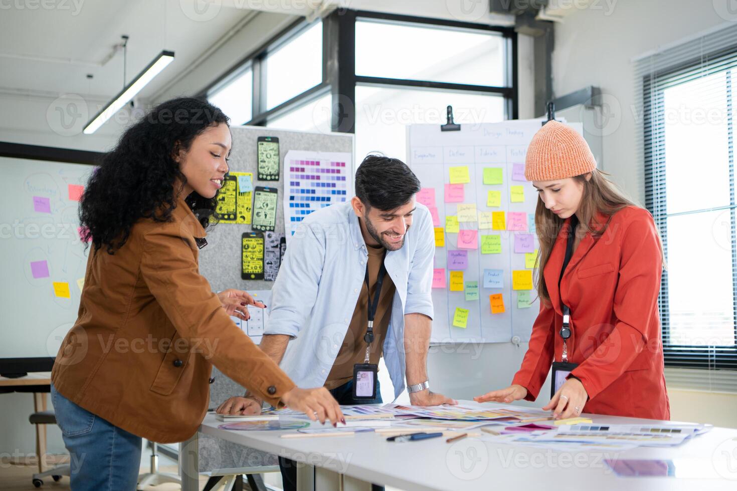 Multiethnic young business people working together in modern office, Collaborate to designing an application for use on the internet network. photo