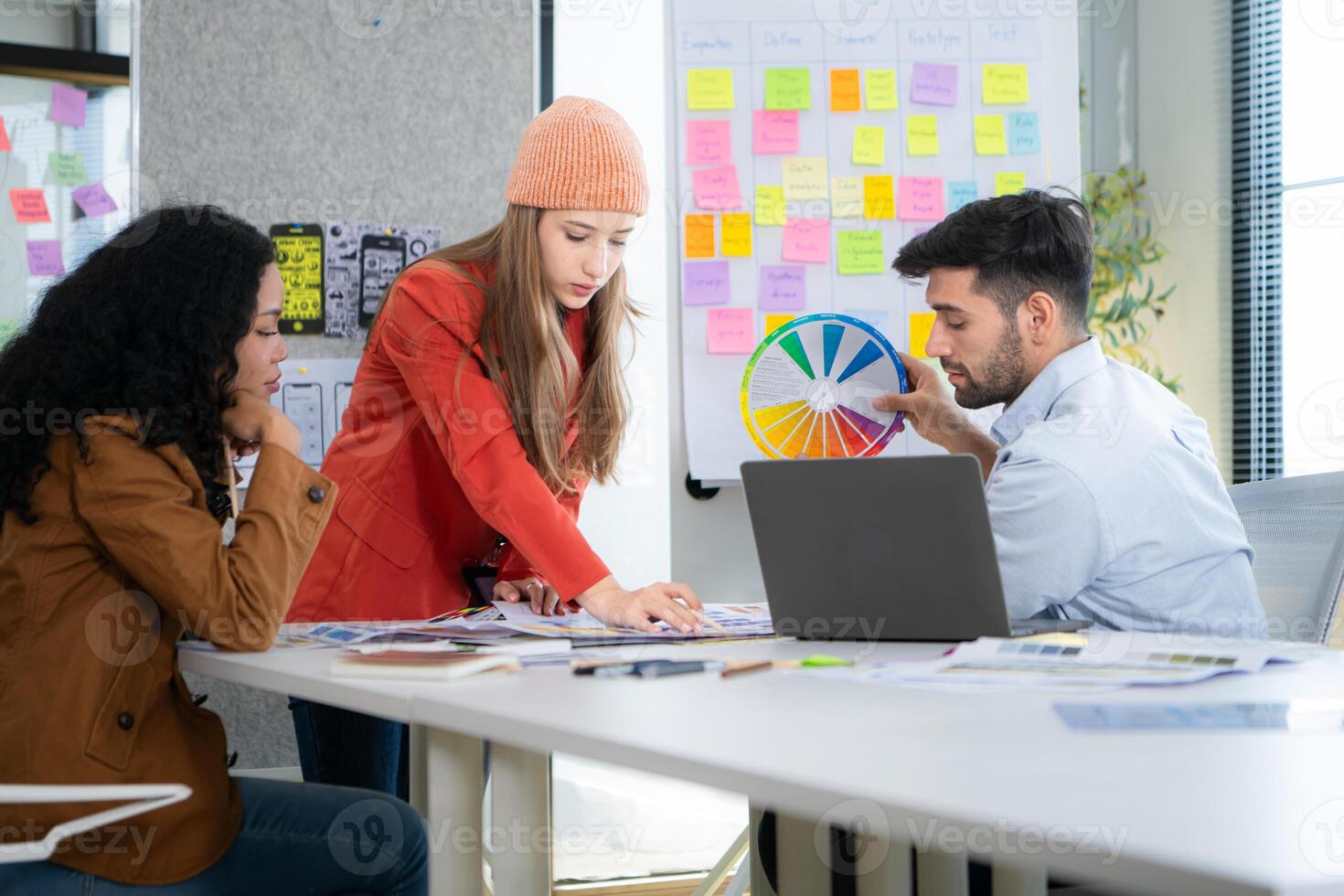 Multiethnic young business people working together in modern office, Collaborate to designing an application for use on the internet network. photo