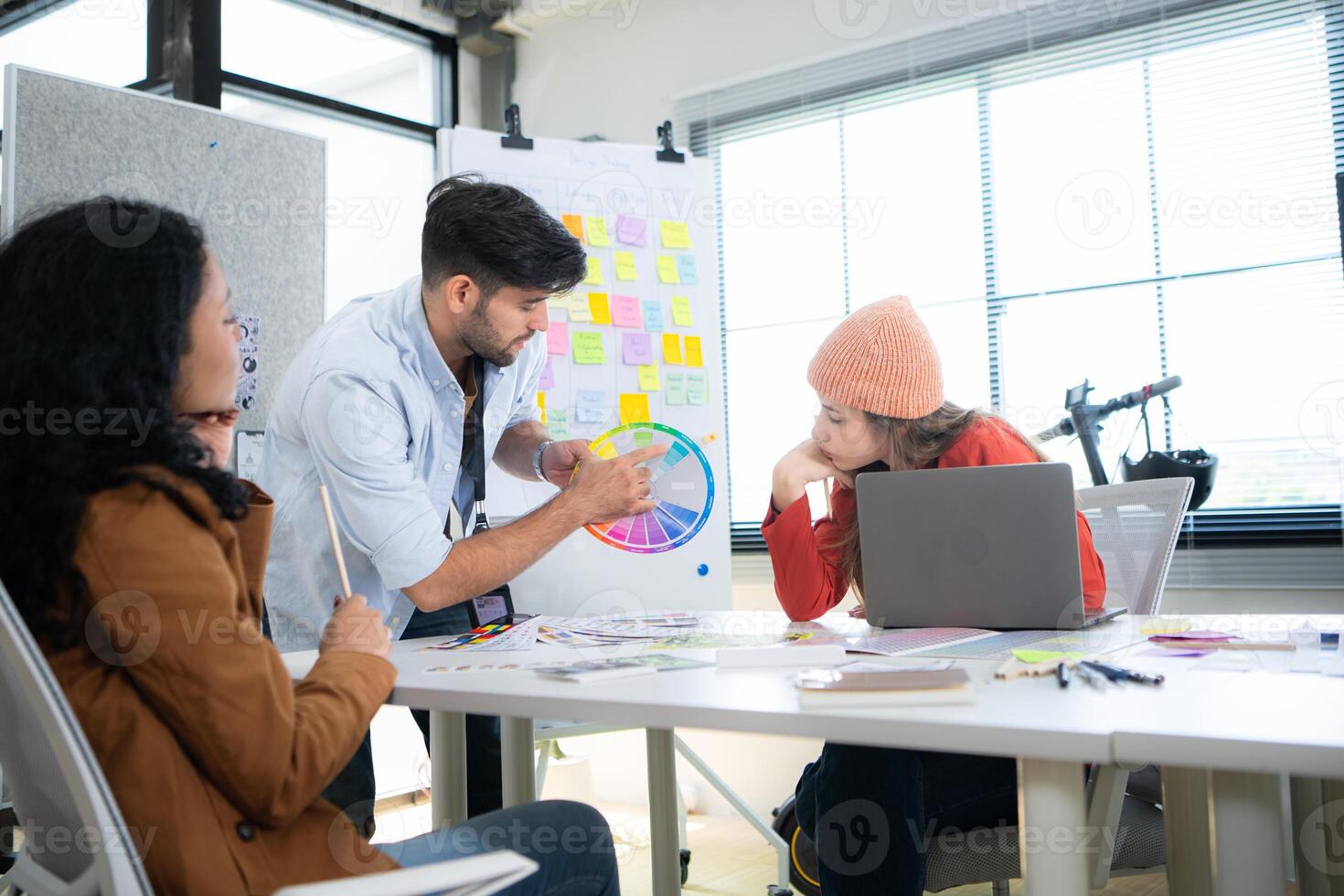 Multiethnic young business people working together in modern office, Collaborate to designing an application for use on the internet network. photo