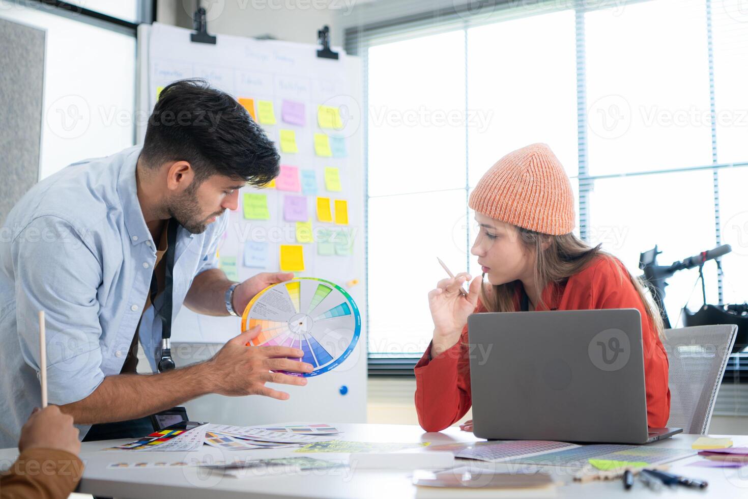 Multiethnic young business people working together in modern office, Collaborate to designing an application for use on the internet network. photo