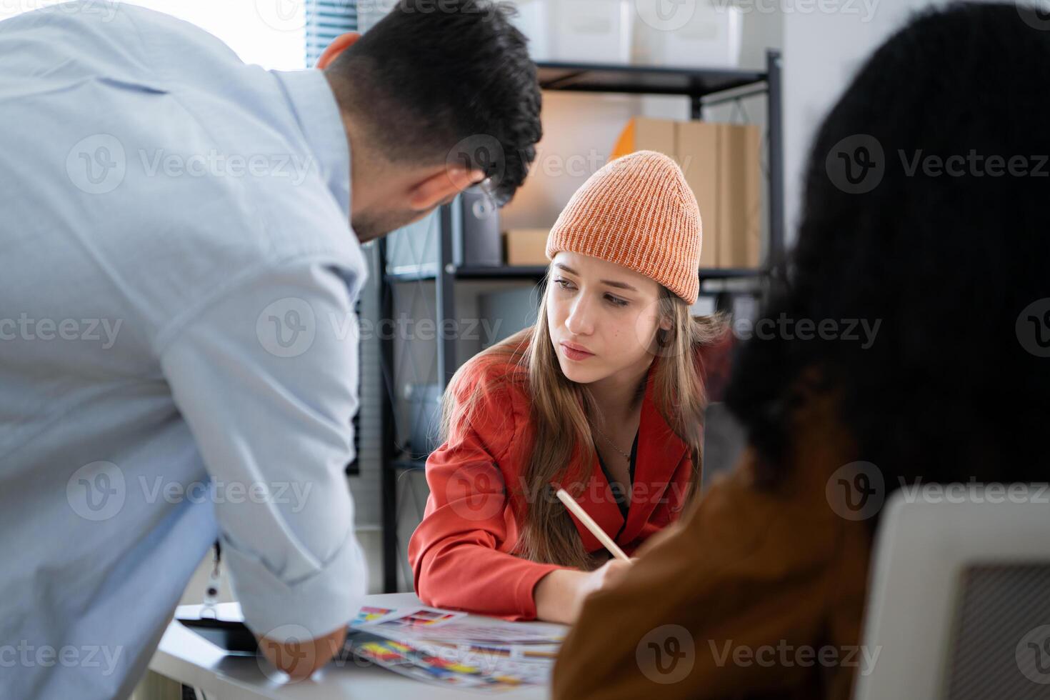 Multiethnic young business people working together in modern office, Collaborate to designing an application for use on the internet network. photo