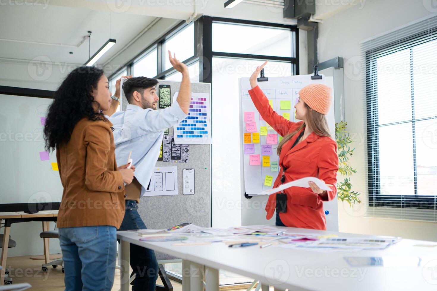 Multiethnic young business people working together in modern office, Collaborate to designing an application for use on the internet network. photo