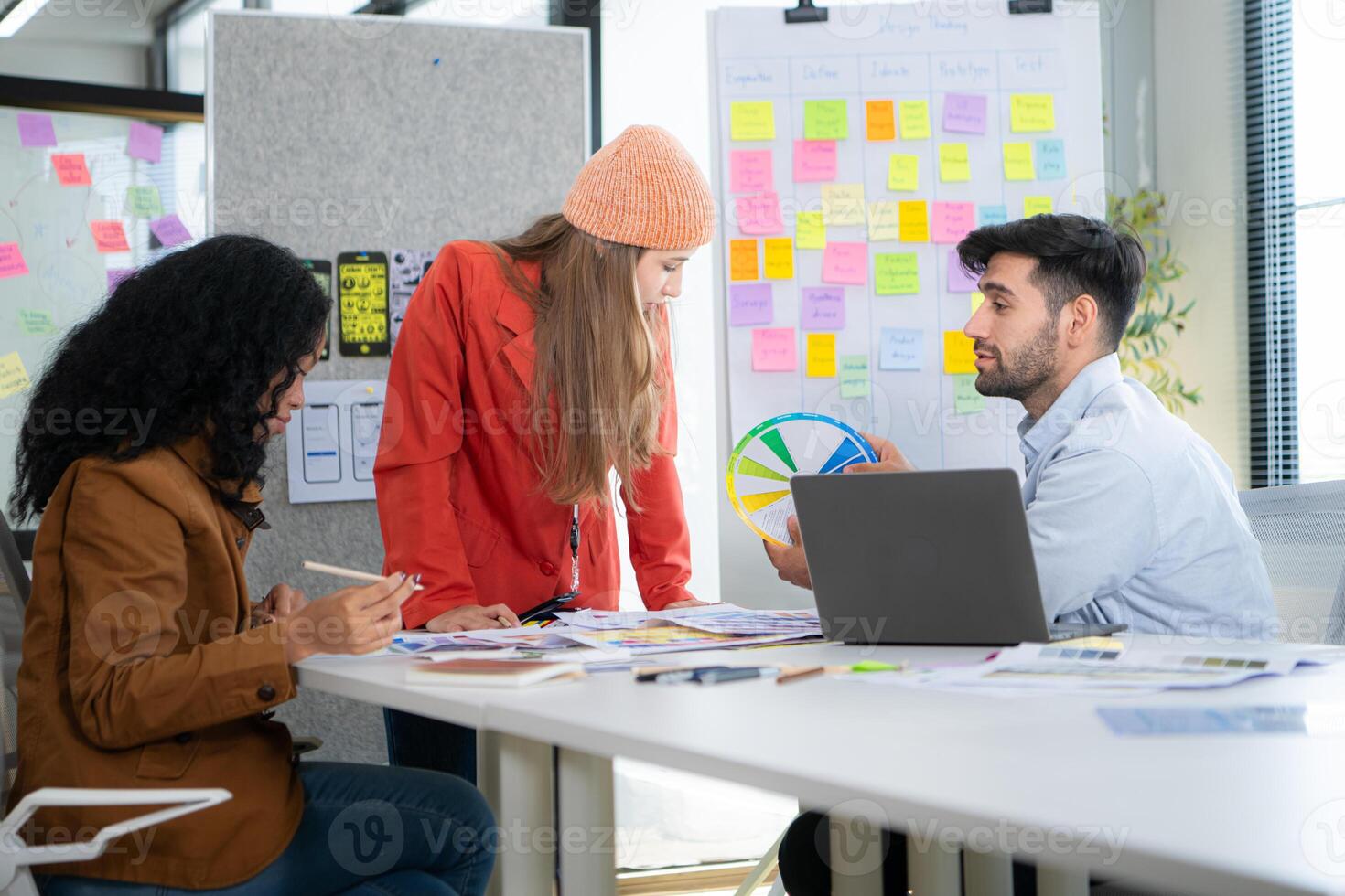 Multiethnic young business people working together in modern office, Collaborate to designing an application for use on the internet network. photo