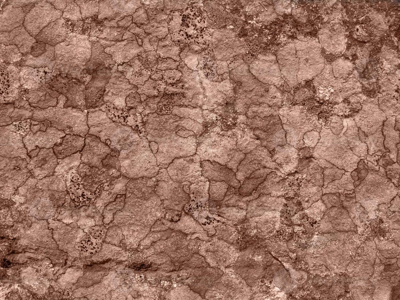 Flat stone surface with a different color pattern. Rock stone background photo