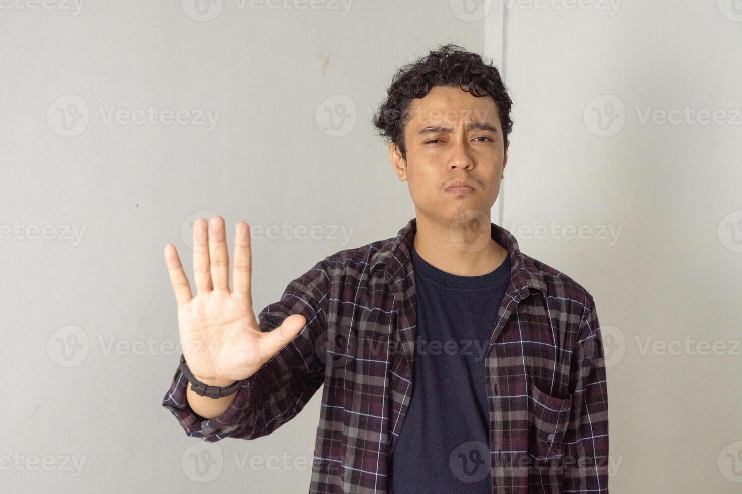 Man making stop gesture photo