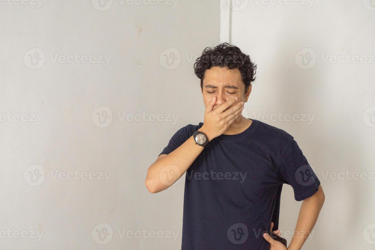 Tired person yawning feeling overworked and needing break. photo