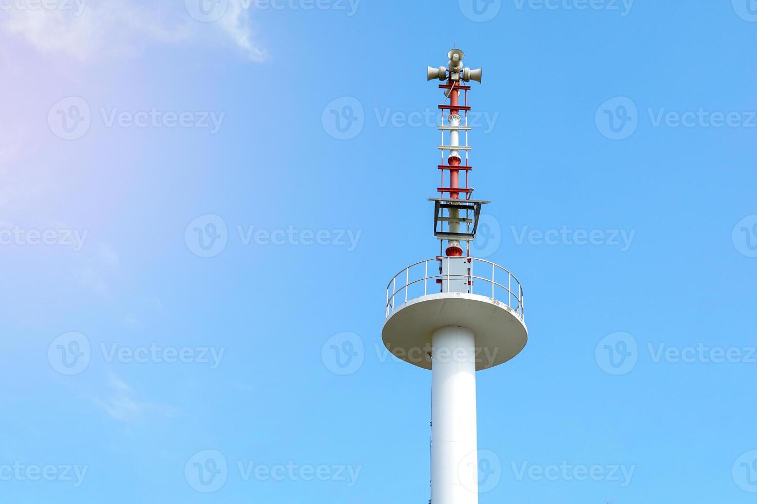 Flood warning tower on the background of a bright daytime sky. soft and selective focus. photo