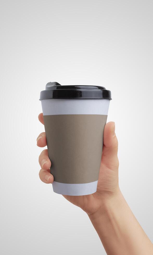 Hand holding a takeaway coffee cup in a blank plastic or paper design, perfect for branding, promotional content, or product presentation photo