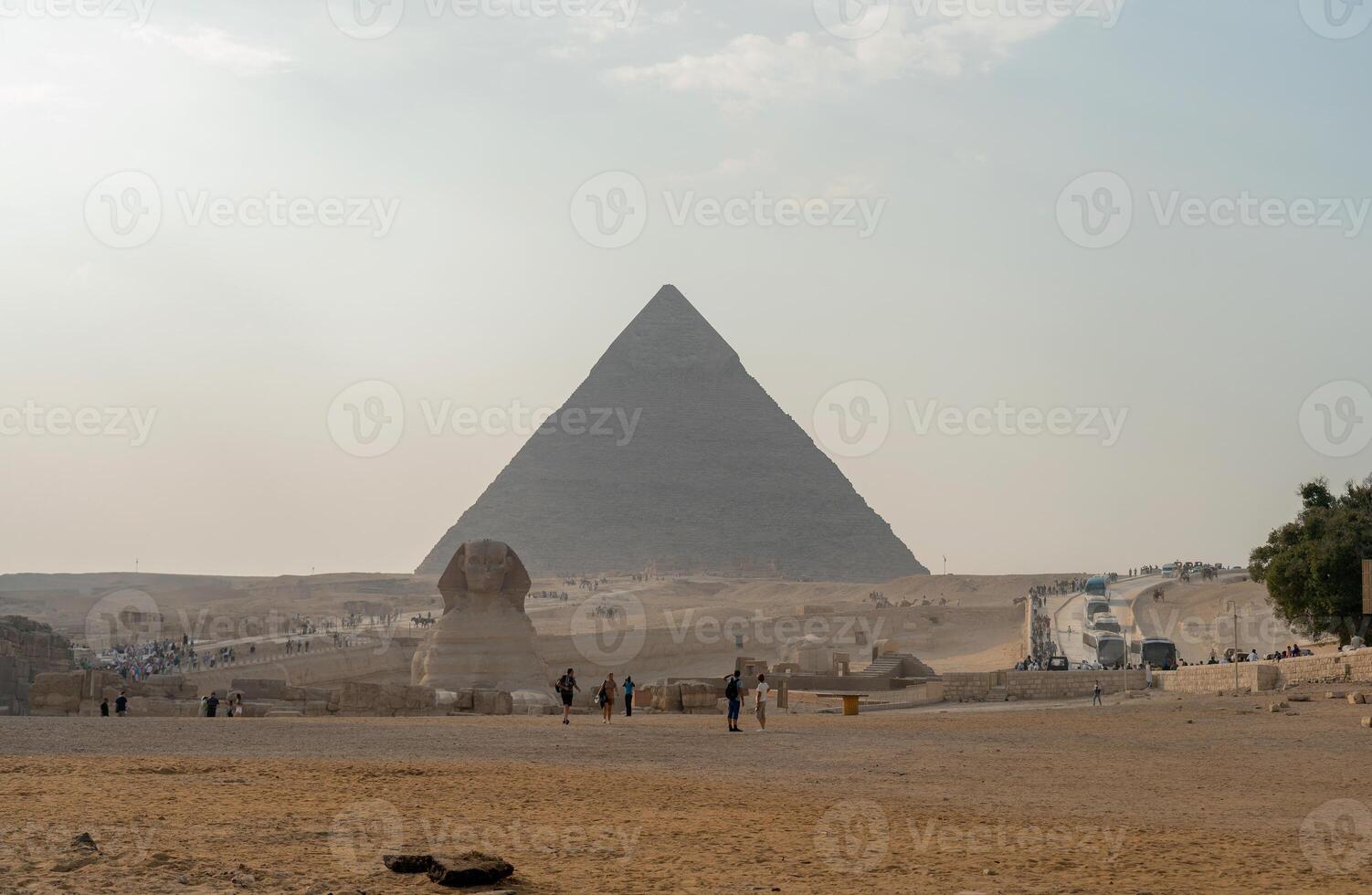 Egyptian Pyramid Of Khufu Cheops With The Sphinx In The Background photo