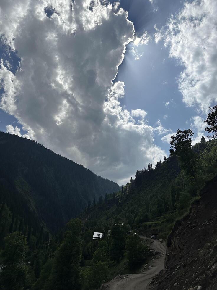 A dirt road in the mountains photo
