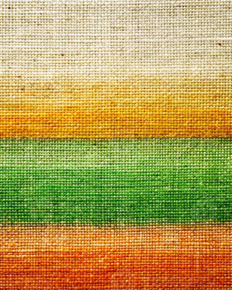 Colorful stripes on a fabric background photo