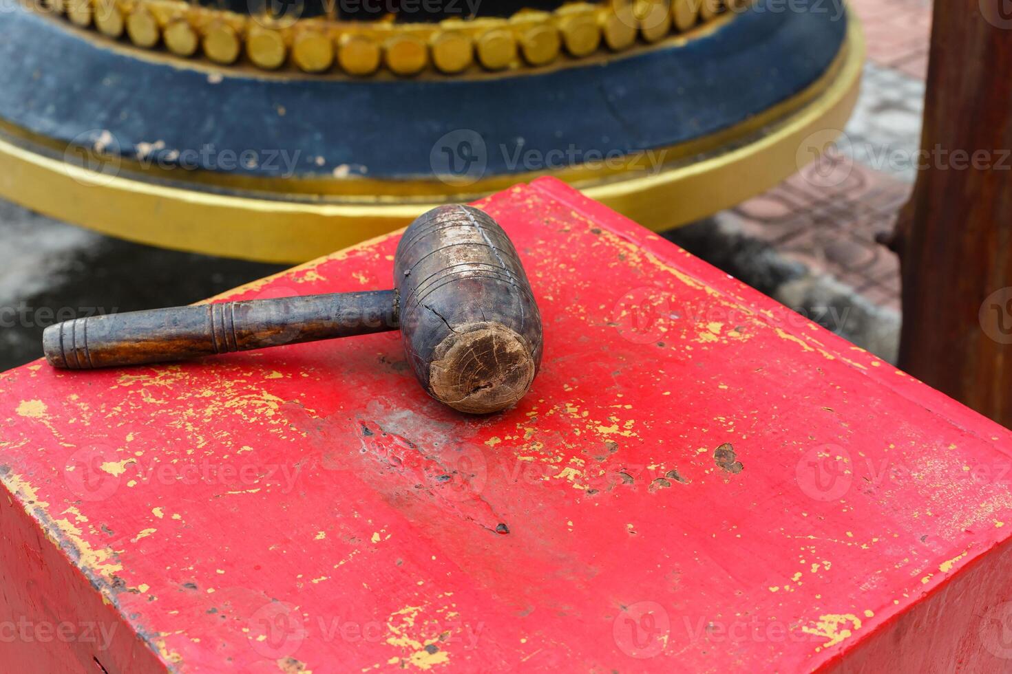 wooden hammer for striking the bell photo