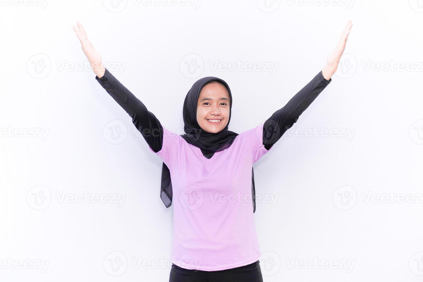 Basic gymnastics movements demonstrated by women wearing hijabs and purple clothes photo