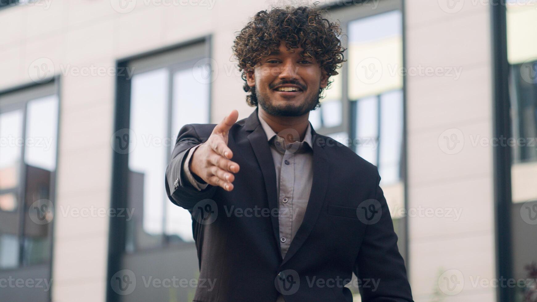 Close up Indian business worker man Arabian businessman male entrepreneur employer manager leader HR recruiter extend hand for handshake welcome gesture handshaking inviting formal greeting in city photo