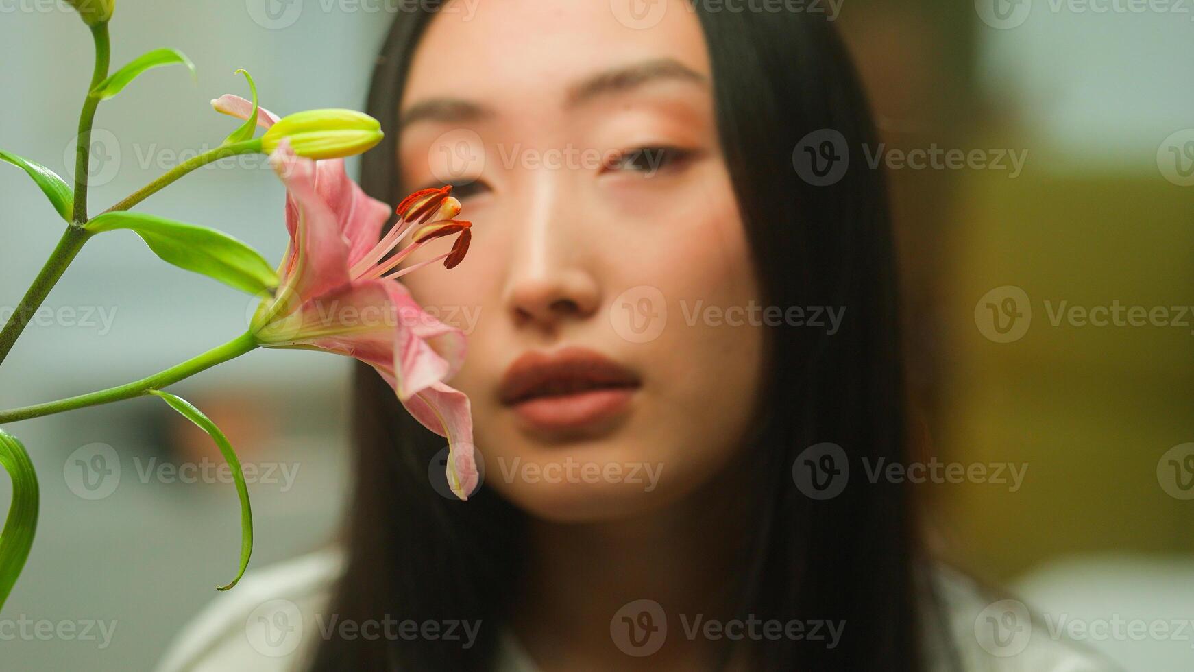 Asian woman portrait face beauty female sensual Chinese Korean Japanese girl face pink flower lily natural organic cosmetics fresh bloom smell cosmetology moisturizer skin care health medicine allergy photo
