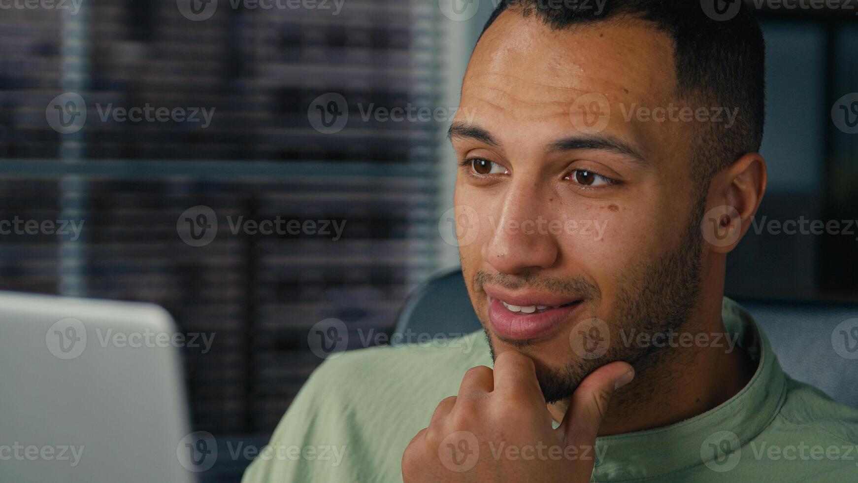 Excited happy african american man businessman winner checking email reading good news on laptop in office celebrate business success online victory get great opportunity career growth new job offer photo