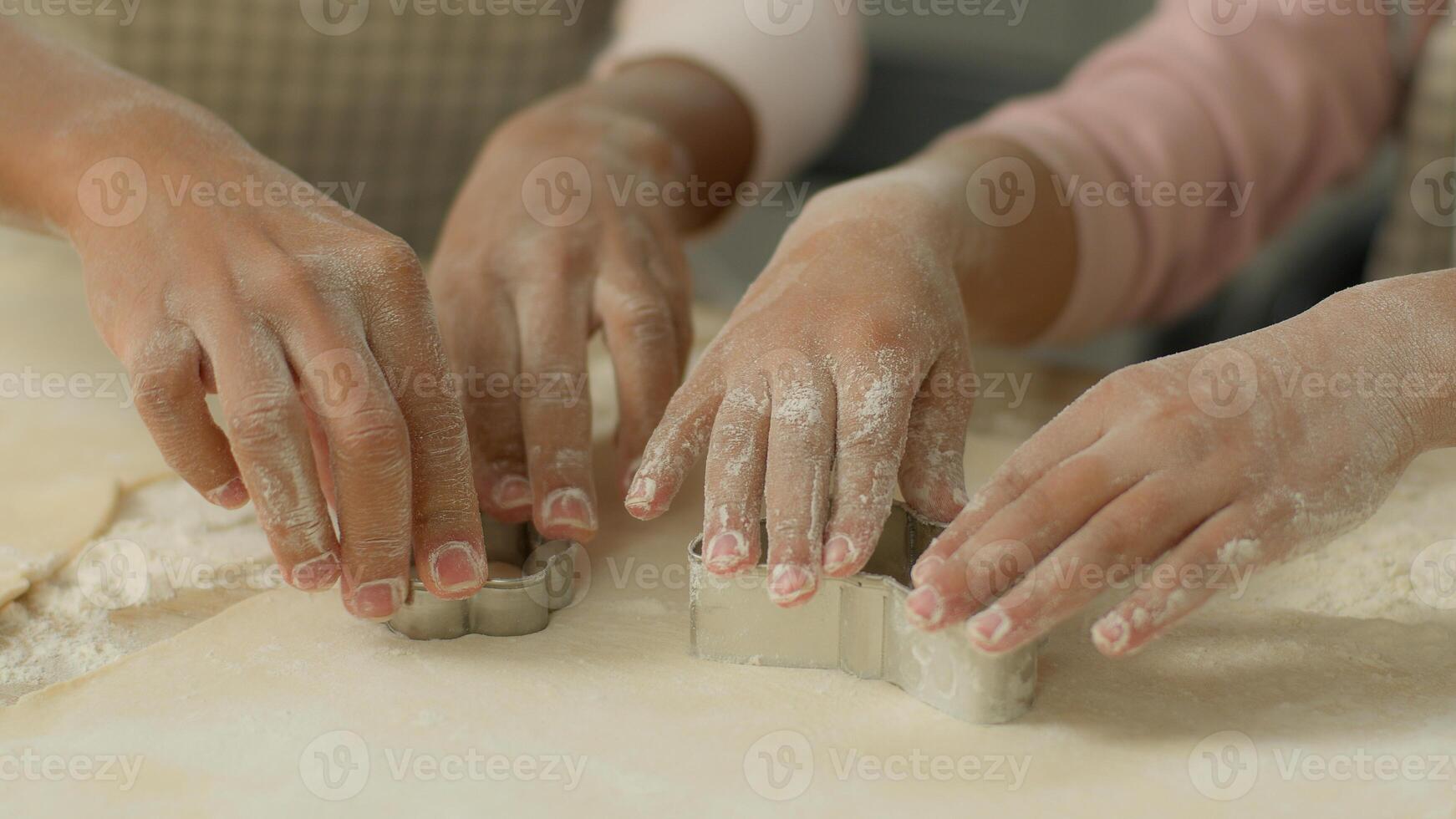 Close up dirty flour hands arms African American family mother mom woman female little girl daughter child kid cooking together kitchen cook teaching cookie mold cut out forms shapes cutter of dough photo