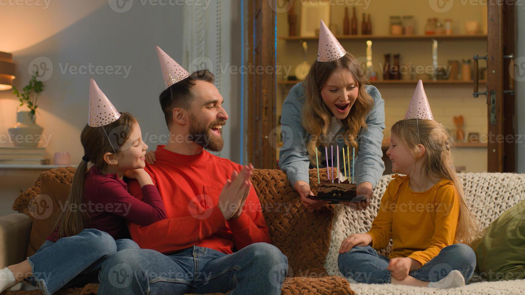 Happy birthday celebration little child kid daughter baby birth party at home mom dad congratulate festive cake blowing candles wish surprise celebrate Caucasian family children sing together holiday photo