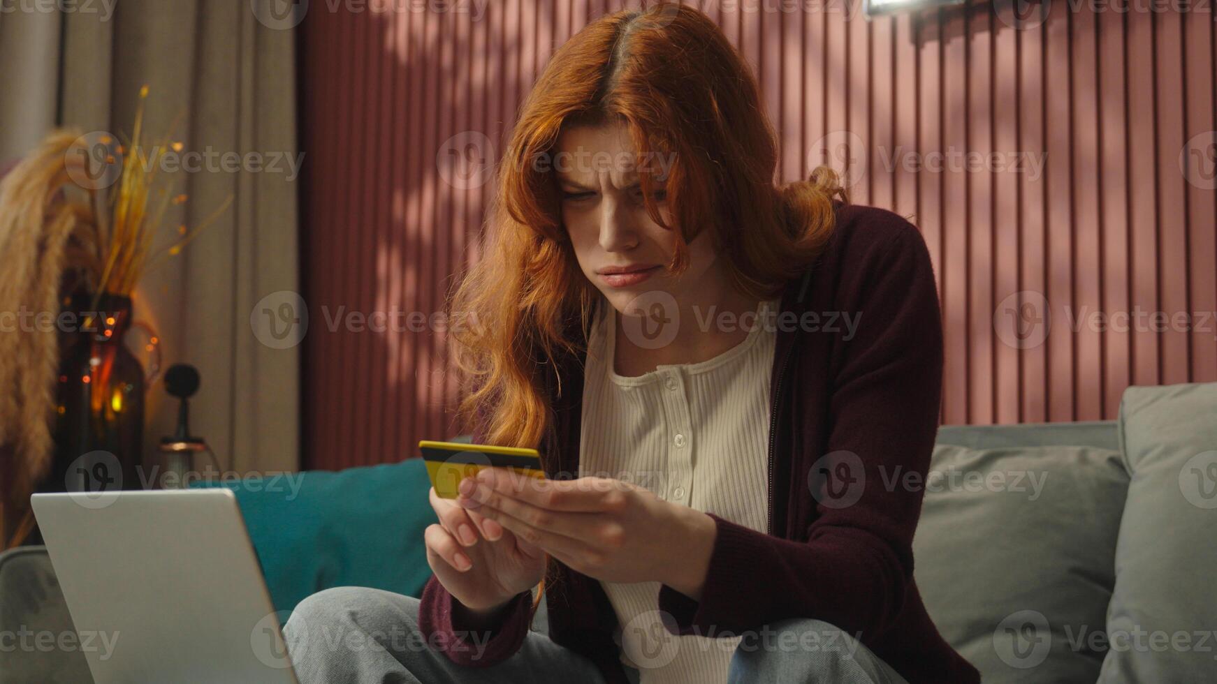 Caucasian confused puzzled woman try pay credit bank card online shopping home internet store laptop computer payment problem money trouble female girl client enter wrong password failure error fraud photo