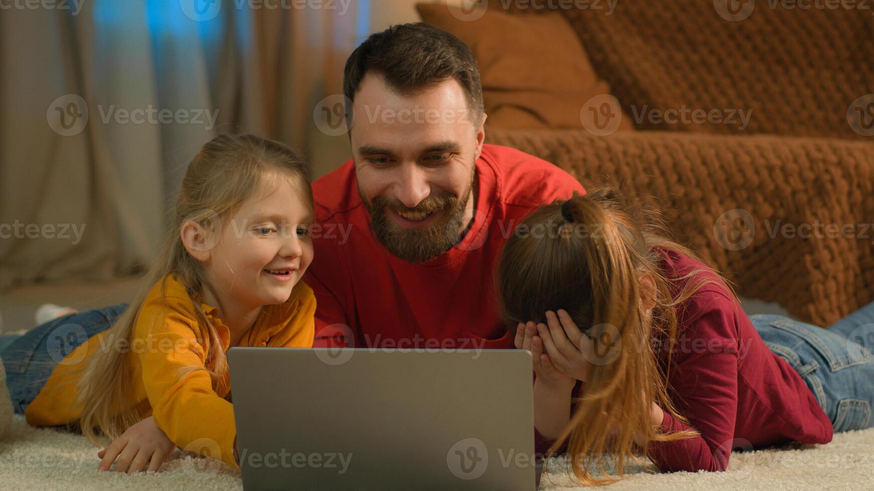 Caucasian dad children kids little girls using computer watch laptop at home single parent father teach daughters help parental control difficult problem with online education school homework learning photo